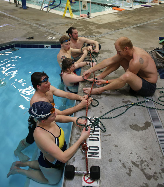 The athletes practice knots before submerging. 